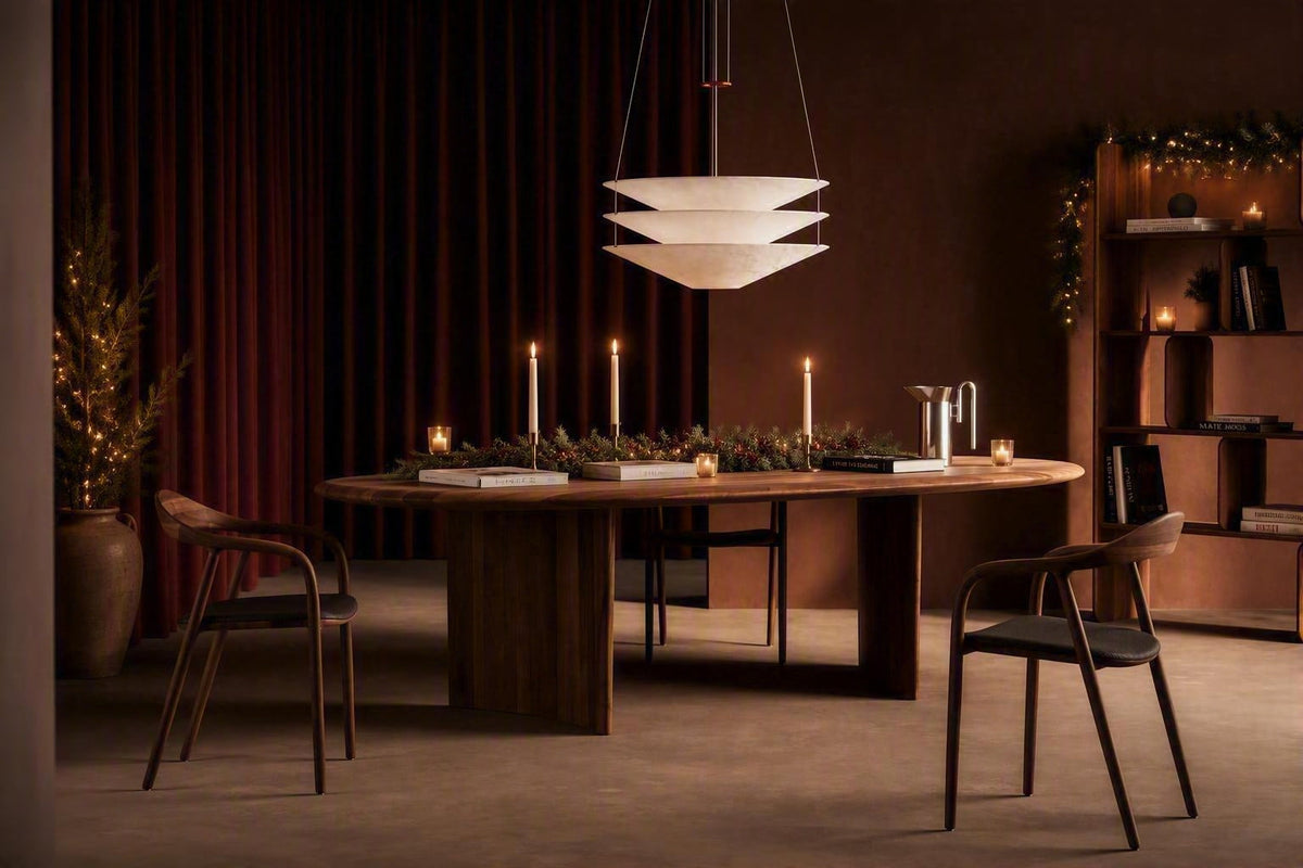 Walnut oval dining table with matching dining chairs by Artisan in a beautiful Christmas home