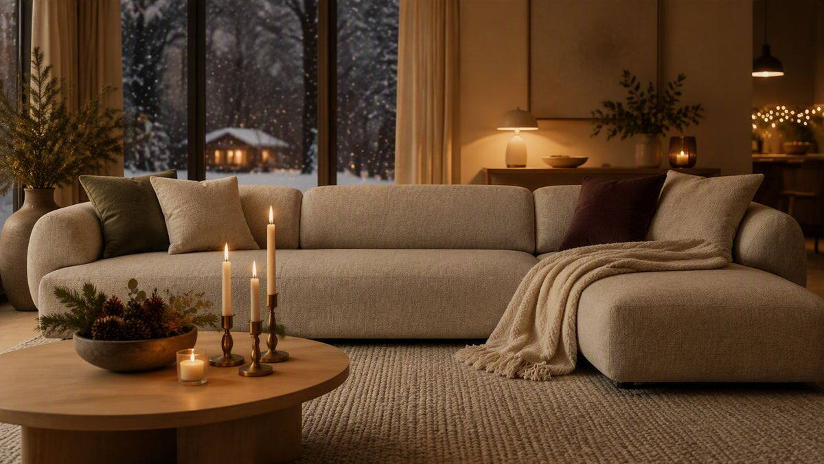 Chaise longue sofa in light grey styled with cosy throws and cushions for a festive feeling at Christmas