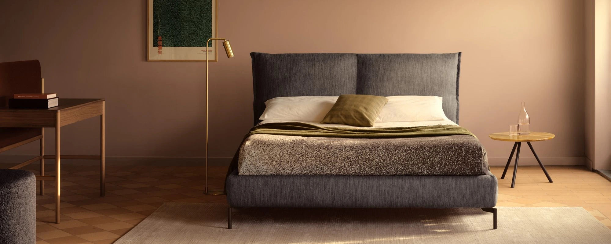 Modern bedroom with a gray upholstered bed, side tables, and a mirror.